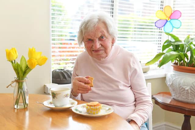 Barbara Draper, 87, enjoying her afternoon tea along with some home-cooked cakes.
