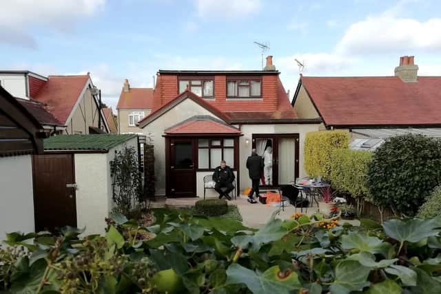 Detectives at the back of the home in Southcroft Road, Gosport after the killing