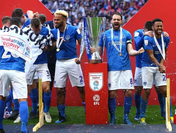 Ronan Curtis celebrates with teammates following Pompey's victory over Sunderland in the Checkatrade Trophy final at Wembley in March