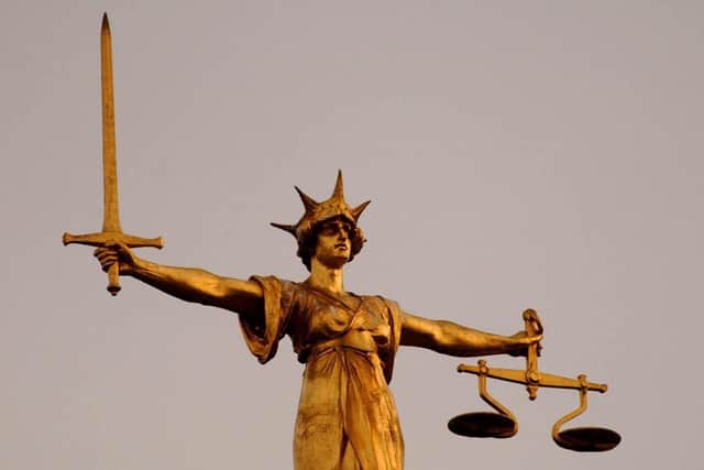 The Scales of Justice on top of the Old Bailey in central London.