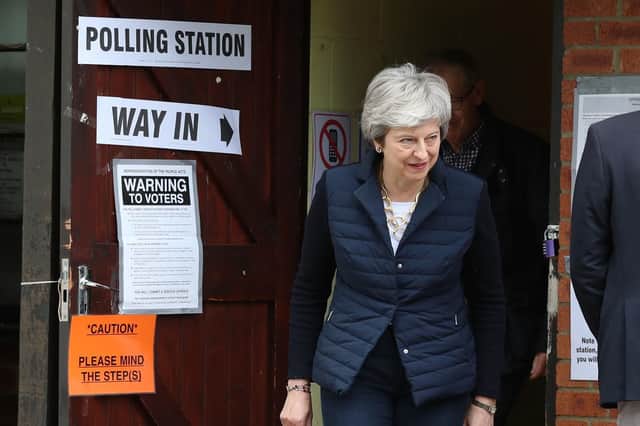 Prime Minister Theresa May leaves after casting her vote at a polling station near her home in the Thames Valley Picture: Andrew Matthews/PA Wire