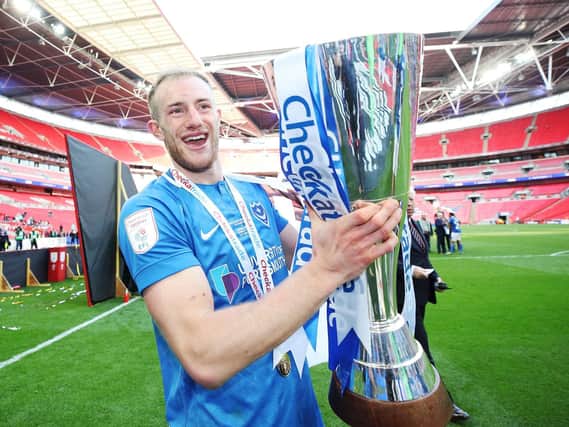Matt Clarke celebrates Pompey's Checkatrade Trophy triumph. Picture: Joe Pepler