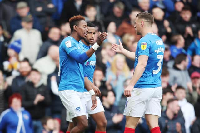 Jamal Lowe celebrates with his Pompey team-mates. Picture by Joe Pepler