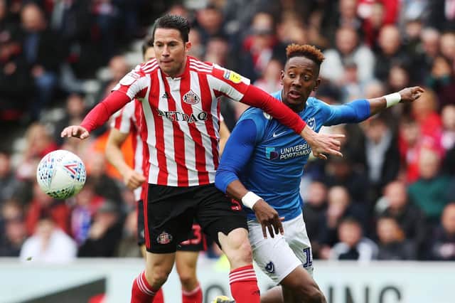 Jamal Lowe battles Bryan Oviedo for the ball at Sunderland earlier this season