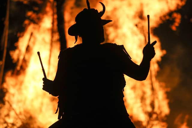 A member of the Pentacle Drummers is silhouetted in front of the burning wickerman during the Beltain Festival, an ancient Celtic celebration to mark the beginning of summer, at Butser Ancient Farm, Waterlooville, Hampshire. PRESS ASSOCIATION Photo. Picture date: Saturday May 4, 2019. Photo credit should read: Andrew Matthews/PA Wire