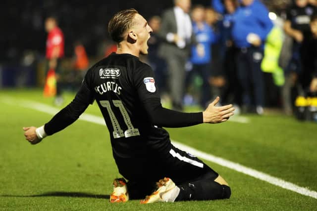 Ronan Curtis celebrates his winner at Bristol Rovers in August. Picture: Joe Pepler