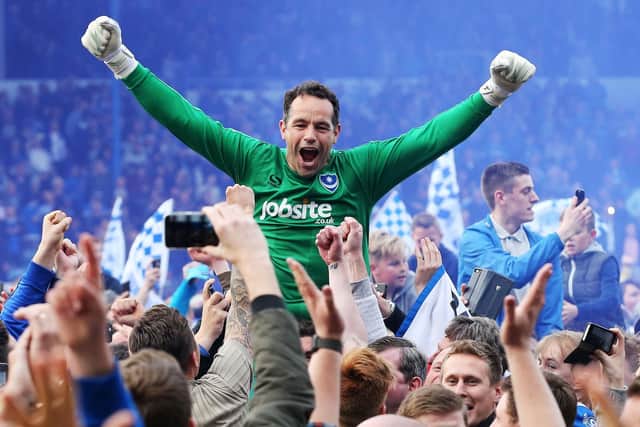 David Forde celebrates Pompey's League Two title success. Picture: Joe Pepler
