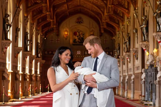 The Duke and Duchess of Sussex with their baby son, who was born on Monday morning, during a photocall in St George's Hall at Windsor Castle in Berkshire. Picture: Dominic Lipinski/PA Wire