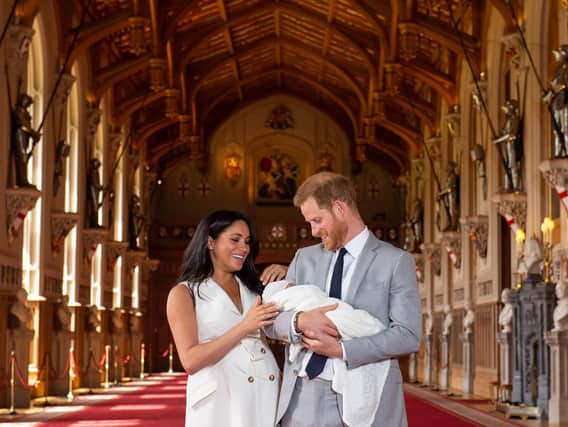 The Duke and Duchess of Sussex with their baby son, who was born on Monday morning, during a photocall in St George's Hall at Windsor Castle in Berkshire. Picture: Dominic Lipinski/PA Wire