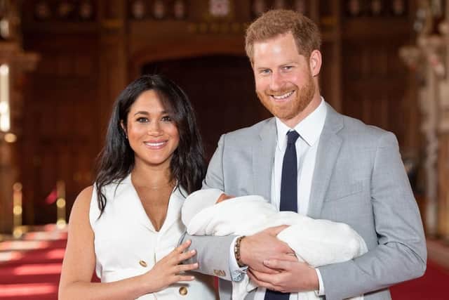 The Duke and Duchess of Sussex with their baby son, who was born on Monday morning, during a photocall in St George's Hall at Windsor Castle in Berkshire. Picture: Dominic Lipinski/PA Wire