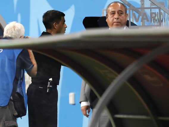 Referee Enrique Caceres watches the VAR during the group B match between Iran and Portugal at the World Cup last year. (AP Photo/Pavel Golovkin)