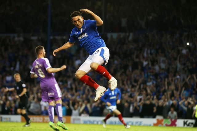 Gary Roberts celebrates his penalty during the 2-2 draw at Fratton Park, with Peter Hartley in the background. Picture: Joe Pepler