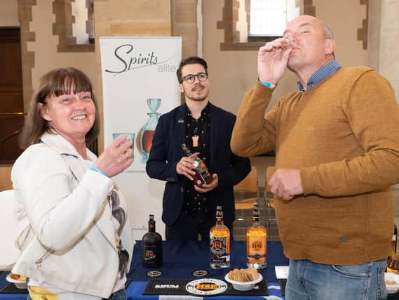 Pictured is: Debbie and Peter Callow with Paul from Spirits Elite.

Picture: Keith Woodland (110519-3)
