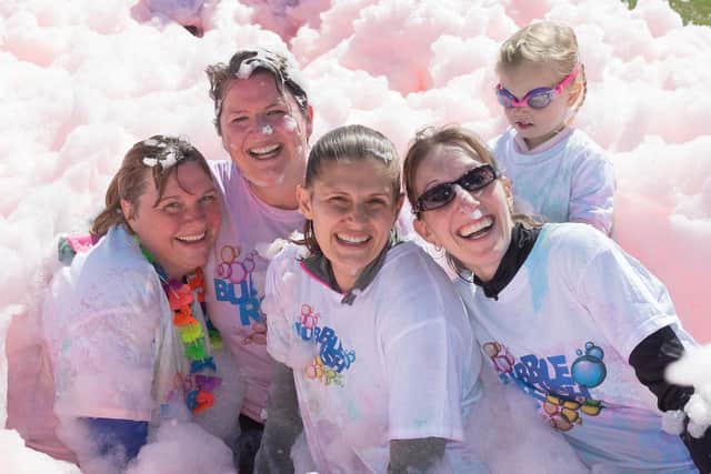 Bubbly brilliant: Competitors in the Portsmouth Bubble Rush.

Picture: Keith Woodland (110519-3)