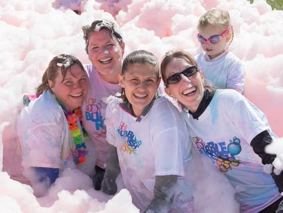 Bubbly brilliant: Competitors in the Portsmouth Bubble Rush.

Picture: Keith Woodland (110519-3)
