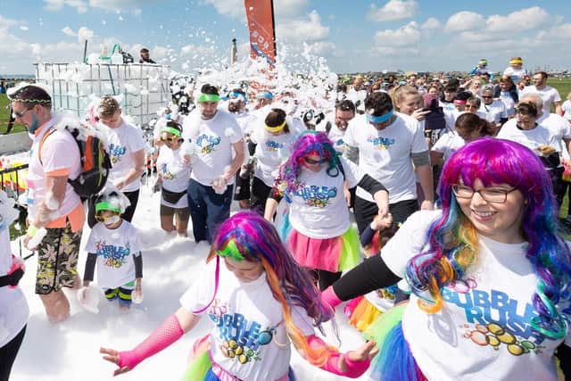 Pictured is: Competitors sprayed with foamPicture: Keith Woodland (110519-33)