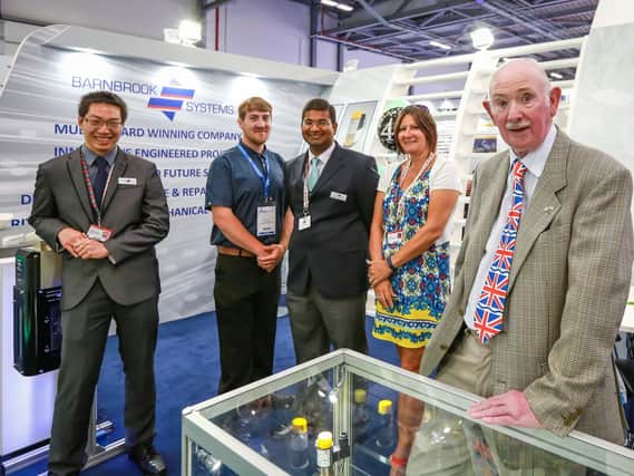 Barnbook Systems Ltd's exhibition team. From left, graduate engineer Lee Wei Jack, apprentice Shane Hutton, quality manager Vic Gunesekaran, head of administration Jane Hughes and managing director Tony Barnett.