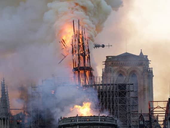 The steeple and spire collapses as smoke and flames engulf the Notre-Dame Cathedral in Paris on April 15, 2019. 

GEOFFROY VAN DER HASSELT/AFP/Getty Images)