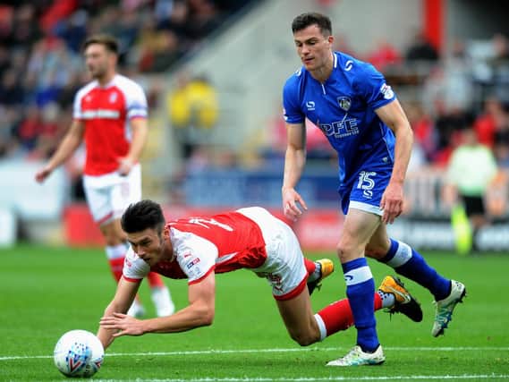 George Edmundson, right, in action for Oldham against Rotherham Picture Jonathan Gawthorpe