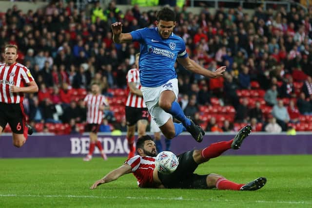 Alim Ozturk's challenge on Pompey's Gareth Evans Picture: Joe Pepler