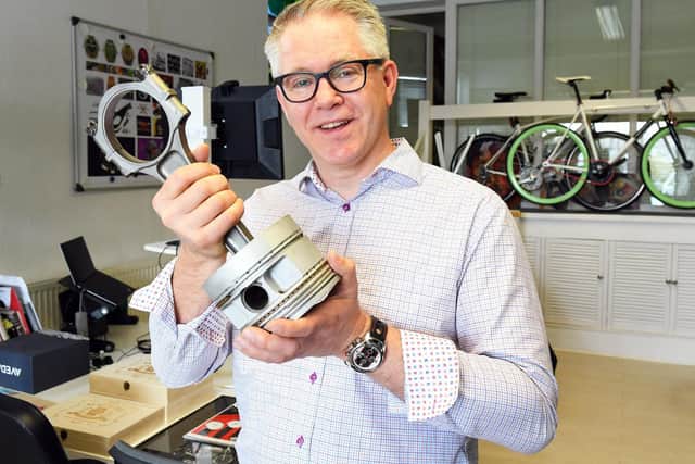 Zero West in Emsworth. Co-founder Andrew Brabyn with a con rod and piston from a Rolls Royce Merlin engine, the engine that powered the legendary Spitfire in WW11 and has now inspired Andrew and fellow Co-founder Graham Collins to produce timepieces with a 'Spitfire' theme.
Picture by: Malcolm Wells (190410-6656)