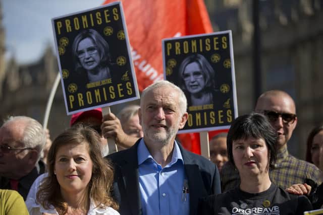 Jeremy Corbyn with campaigners outside parliament during a protest calling for an inquiry into the Battle of Orgreave and the policing of the miners' strike. Picture: Justin Tallis AFP/Getty Images