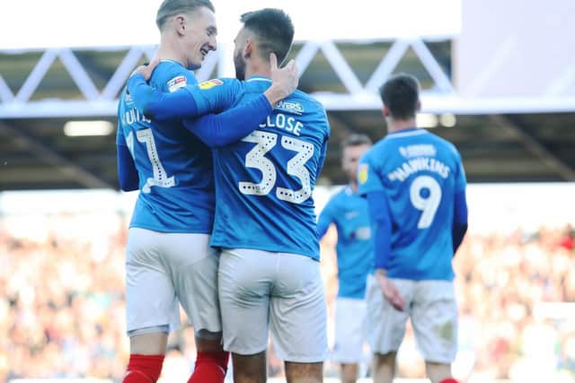 Portsmouth's Ben Close celebrates scoring his first goal of the match with Portsmouth's Ronan Curtis