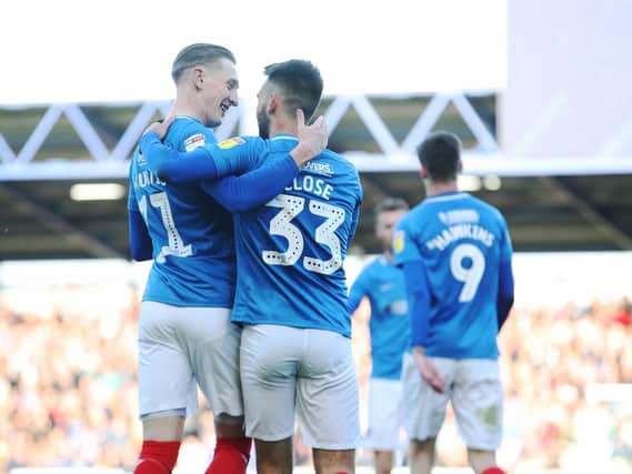 Portsmouth's Ben Close celebrates scoring his first goal of the match with Portsmouth's Ronan Curtis