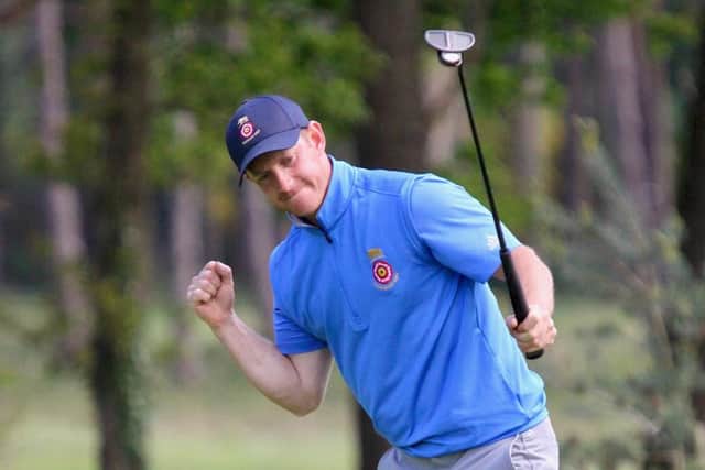Rowlands Castle's Darren Wright makes the winning putt on the 18th against Parkstone's Andy Rideout as Hampshire that beat Dorset. Picture: Andrew Griffin