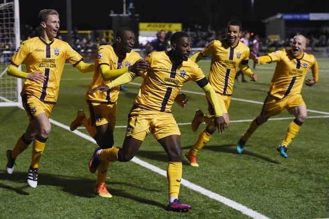 Roarie Deacon celebrates scoring his for Sutton against Cheltenham in the FA Cup during the 2016-17 season. Picture: Daniel Hambury