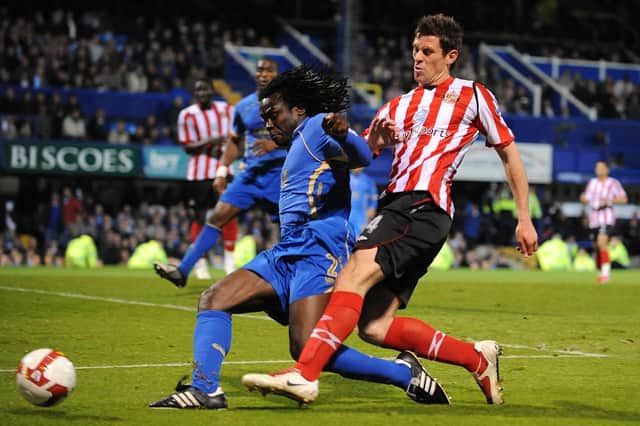 Linvoy Primus battles Sunderland's Daryl Murphy for the ball during his final Pompey appearance