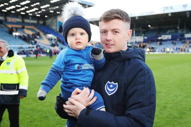 Dion Donohue, seen here with son Mason, has departed Fratton Park following two seasons on the south coast. Picture: Joe Pepler