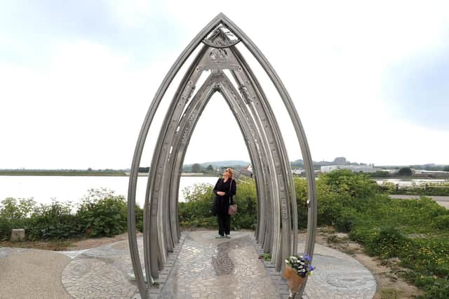 Edwina Abrahams, wife of Maurice Abrahams who died in the Shoreham Airshow crash, views a memorial created by artists Jane Fordham and David Parfitt, to the Shoreham Airshow victims after it was unveiled on the banks of the Adur in Shoreham Picture: Gareth Fuller/PA Wire