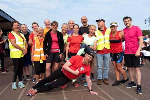 Tim Hardy, front, with the Portsmouth Triathletes and friends at Southsea parkrun on Saturday. Picture: Vernon Nash (180519-006)