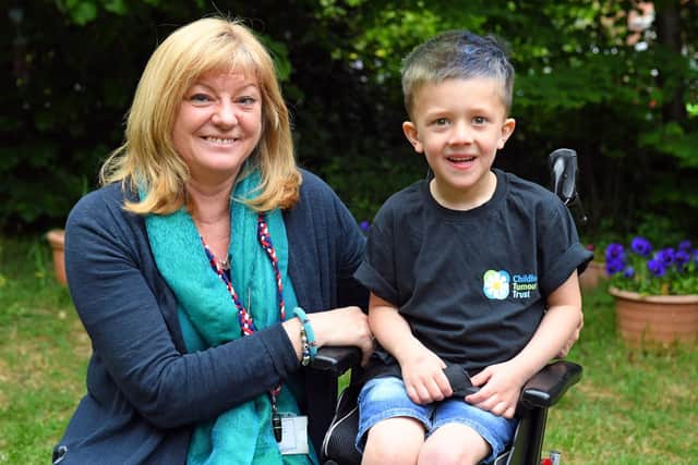 Tommy Chambers at his school, Bedenham Primary School on a 'dress down' dayg to promote awareness of of Tommy's condition as he has an inoperable brain tumour 
Tommy (4) with (left) headteacher Caroline Wood
