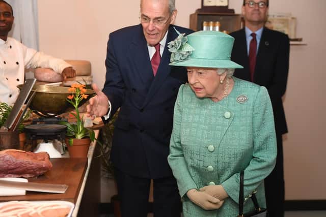 Queen Elizabeth II views goods on display in a replica of one of the original Sainsbury's stores during a visit to Covent Garden, London. Picture: Jeremy Selwyn/Evening Standard/PA Wire