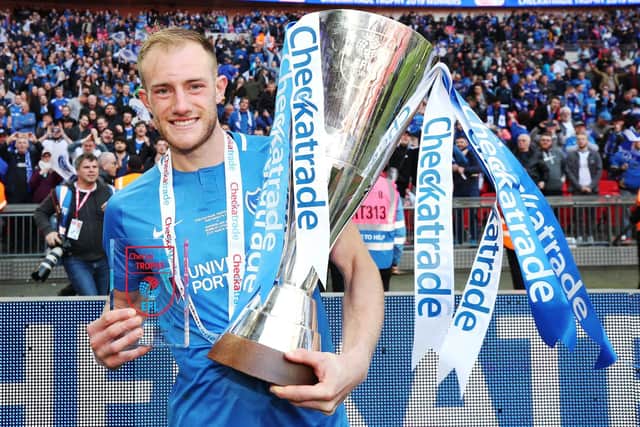 Matt Clarke celebrates with the Checkatrade Trophy. Picture: Joe Pepler