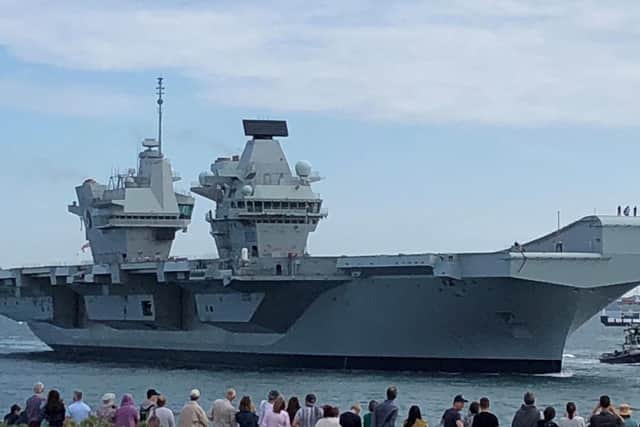 HMS Queen Elizabeth arriving into its home port of Portsmouth. Picture: Ashley Law/PA Wire