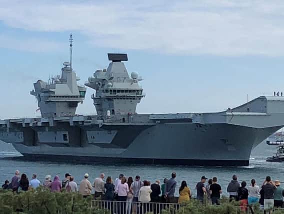 HMS Queen Elizabeth arriving into its home port of Portsmouth. Picture: Ashley Law/PA Wire