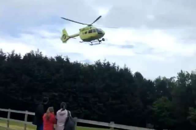Air ambulance helicopter near Lightwater Valley theme park in North Yorkshire, as a child has been airlifted to hospital after an incident at the park. Picture: Emma Rowland/PA Wire