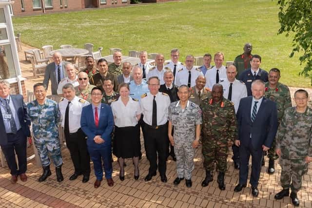 The defence attaches representing 31 nations visiting HMS Collingwood.