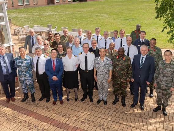 The defence attaches representing 31 nations visiting HMS Collingwood.