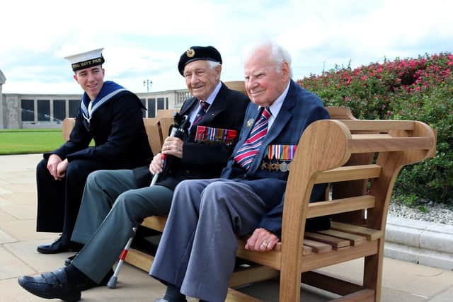 Handout photo issued by the Commonwealth War Graves Commission (CWGC) of RNP Ben Coomber with D-Day veterans, Ron Cross, 98 (centre) and  Bob Jones, 94, during the CWGC Voices of liberation photo call in Portsmouth. Picture: CWGC/PA Wire