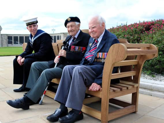 Handout photo issued by the Commonwealth War Graves Commission (CWGC) of RNP Ben Coomber with D-Day veterans, Ron Cross, 98 (centre) and  Bob Jones, 94, during the CWGC Voices of liberation photo call in Portsmouth. Picture: CWGC/PA Wire
