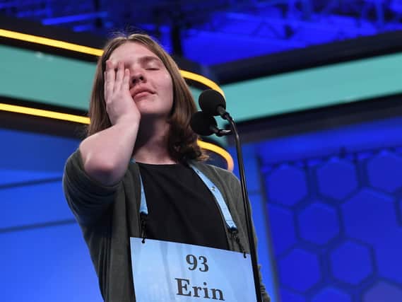 Erin Howard, 14, of Huntsville, Ala., reacts as she prepares to spell her final word as she competes in the finals of the 2019 Scripps National Spelling Bee in Oxon Hill, Md., Thursday, May 30, 2019. She spelled the word correctly and she and seven other spellers will share the 2019 championship. (AP Photo/Susan Walsh)