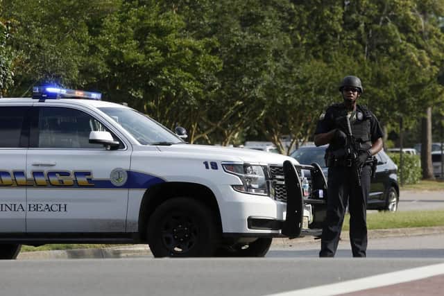 A police officer blocks an entrance to the Virginia Beach Municipal Center off of Princess Anne Road following a shooting Friday, May 31, 2019 in Virginia Beach, Va Picture (Kaitlin McKeown/The Virginian-Pilot via AP)