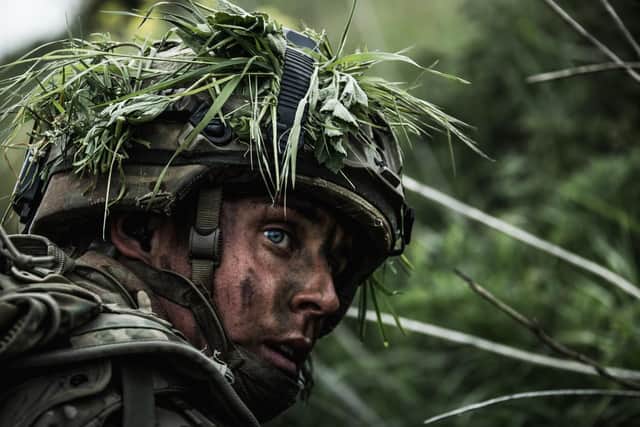 PICTURED: A Royal Marine looks back taking cover in a valley after being pursued by an enemy force.

Royal Marines from 40 Commando experiment with new technology and tactics as part of the Future Commando Force concept.

COMMANDO WARRIOR 2, held on Salisbury Plain, was a chance for 40 Commando to experiment with new command structures and technology as part of the Future Commando Force concept. The new teams ran through several peer-on-peer serials in a combination of rural and urban objectives; each with varying success. With scientific support, plus TES (Tactical Engagament Software - a laser based battle simulation system), the command were able to analysis the effectiveness of each of the new team structures.

The Commando now looks to the future on Commando Warrior 3, which will take these exercise lessons (both failures and successes) and combine them with new technology.