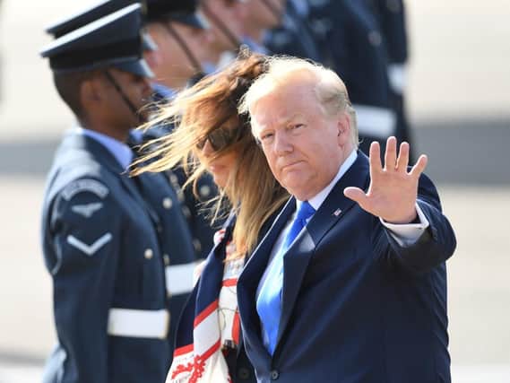US President Donald Trump and his wife Melania arrive at Stansted Airport in Essex, aboard Air Force One for the start of his three day state visit to the UK. Picture: Joe Giddens/PA Wire