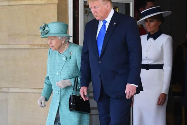 Queen Elizabeth II, Donald Trump and Melania Trump, during the Ceremonial Welcome at Buckingham Palace, London, on day one of US President Donald Trump's three day state visit to the UK.