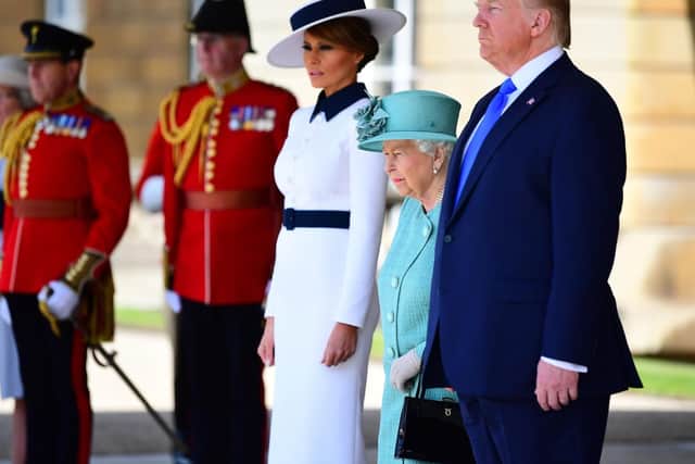 Melania Trump, Queen Elizabeth II and Donald Trump during the Ceremonial Welcome at Buckingham Palace, London, on day one of US President Donald Trump's three day state visit to the UK.